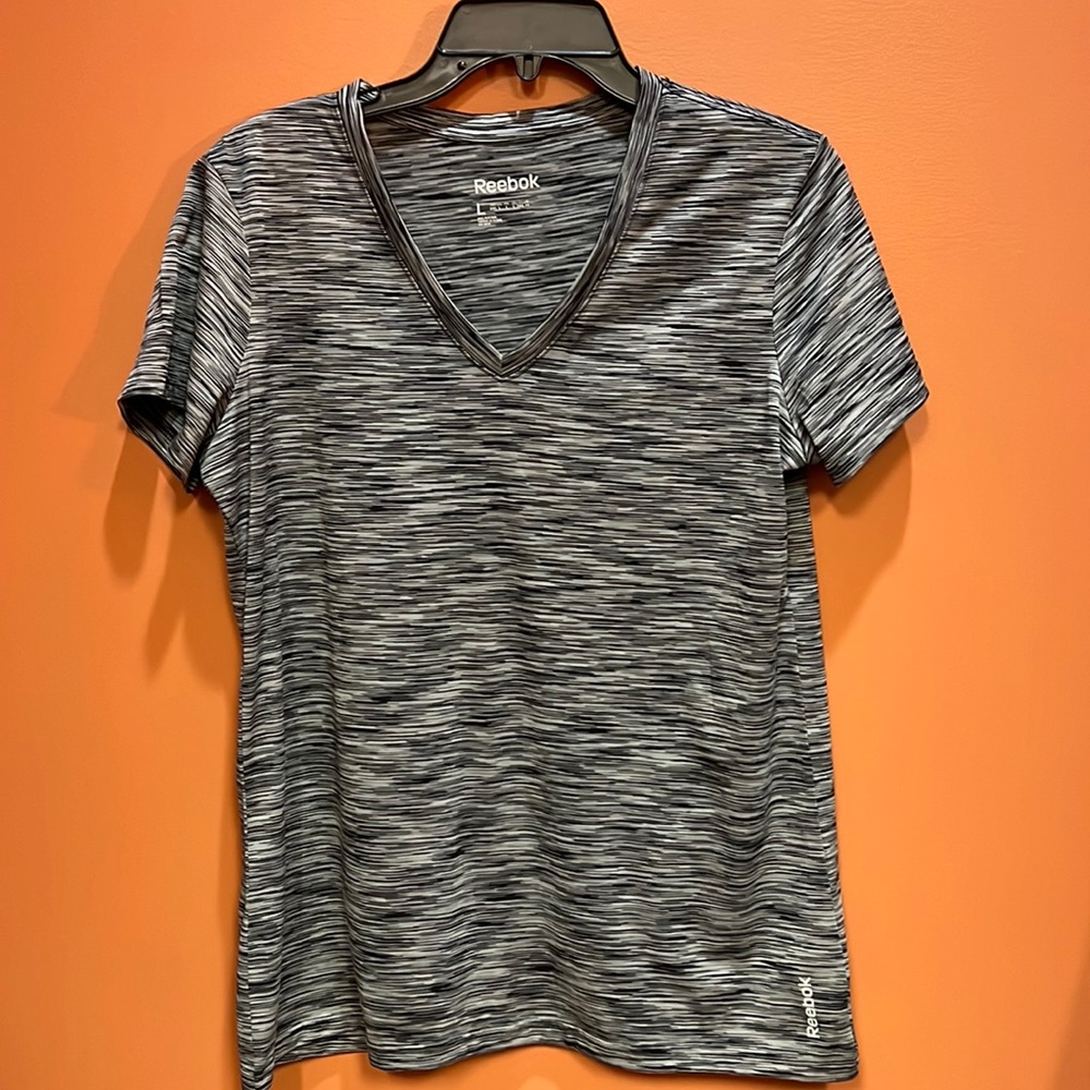Like new Reebok v neck active top. Size large